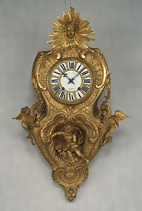 青銅製怪獣人物文様掛時計
