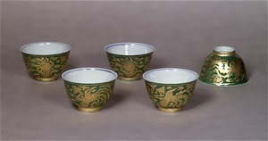 Tea cups, phoenix design, gold leaves on overglaze yellowish-green enamel