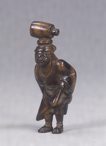 Wood Netsuke., Oharame (Woman vendors from O-hara known to carry merchandise on their heads).