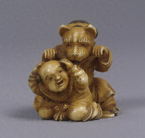 Toggle (&quot;Netsuke&quot;) in the Shape of a Chinese Boy and Fox-Masked Figure