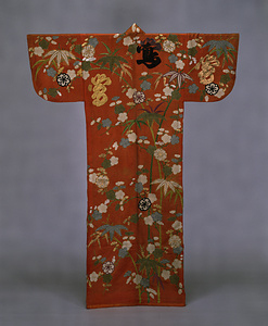 [Kosode] (Garment with small wrist openings) Bamboo and plum design with characters for “bush warbler” on red figured satin ground