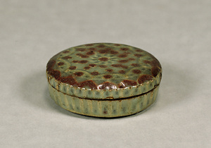 Covered Box Celadon glaze with flower design in underglaze iron and red pigment with white lines