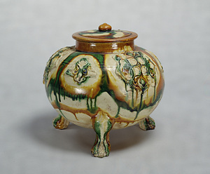Fu(cooking pot) With applied medallions, covered with three-color glaze.