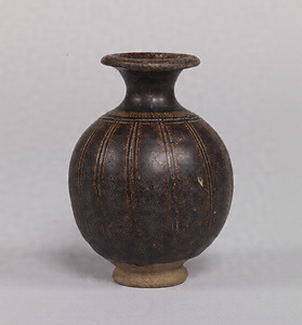 Vase Brown glaze with carved design