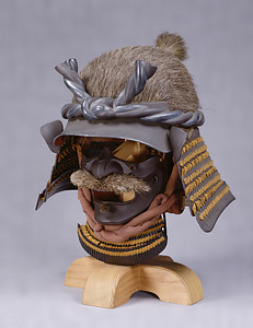 Helmet in the Shape of a Man's Head with Brown Lacing