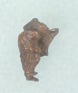 Netsuke, Gohei (Shinto ritual implement made of stick and paper) bearer (signifying a flatterer) design