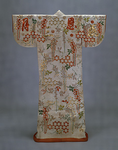 [Uchikake] (Outer garment) Design of stylized tortoiseshells, wisterias, and calligraphy on a white figured-satin ground