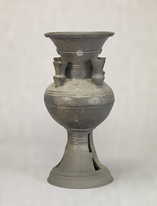 Footed Jar with Smaller Vessels