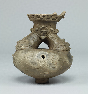 Jar with Spout and Human Figure Ornament