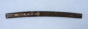 Sword mounting of aikuchi type, Design of shunran flower on aokin lacquer ground.