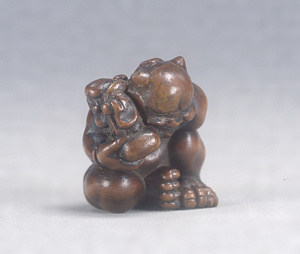 Wood Netsuke., Demon and Daikoku (one of the Seven Gods of Good Fortune).