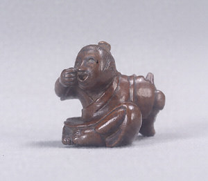 Toggle ("Netsuke") in the Shape of a Child with a Mask