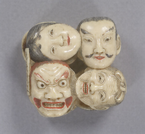 Toggle (&quot;Netsuke&quot;) in the Shape of Clustered Masks
